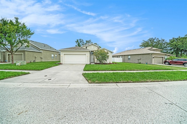 247 Winthrop Dr, Spring Hill, FL 34609 - view of front of property featuring driveway, a front yard, and an attached garage