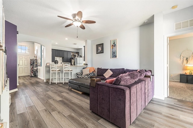 247 Winthrop Dr, Spring Hill, FL 34609 - living room with a ceiling fan, arched walkways, wood finished floors, and recessed lighting