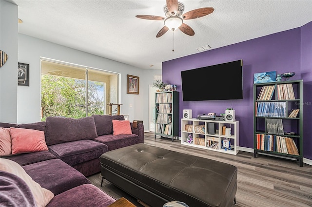 247 Winthrop Dr, Spring Hill, FL 34609 - living area with wood finished floors, ceiling fan, and a textured ceiling