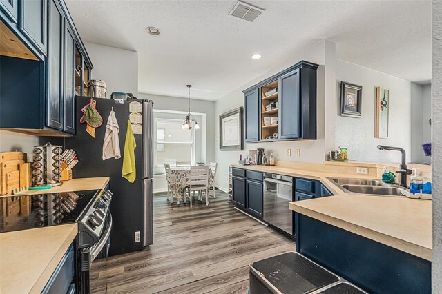 247 Winthrop Dr, Spring Hill, FL 34609 - kitchen with black range with electric cooktop, dishwasher, wood finished floors, open shelves, and light countertops