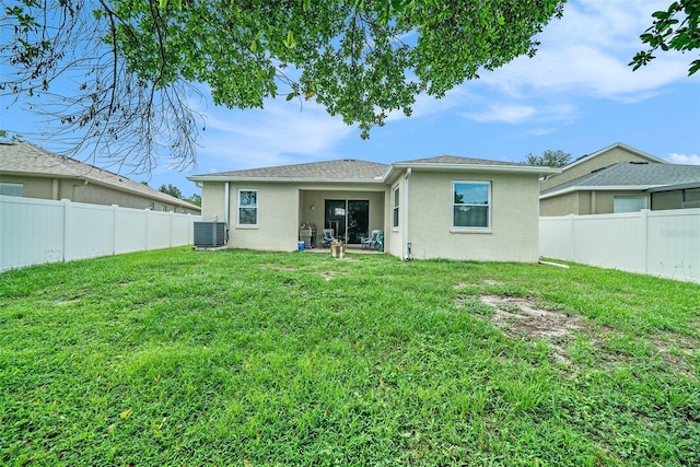 247 Winthrop Dr, Spring Hill, FL 34609 - back of property featuring stucco siding and a fenced backyard