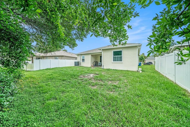 247 Winthrop Dr, Spring Hill, FL 34609 - back of property featuring stucco siding