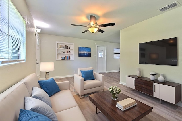 475 W Ethelene St, Bartow, FL 33830 - living area with a ceiling fan, light wood finished floors, and built in shelves