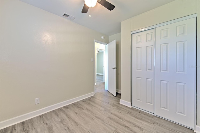475 W Ethelene St, Bartow, FL 33830 - unfurnished bedroom with light wood finished floors, a closet, and a ceiling fan