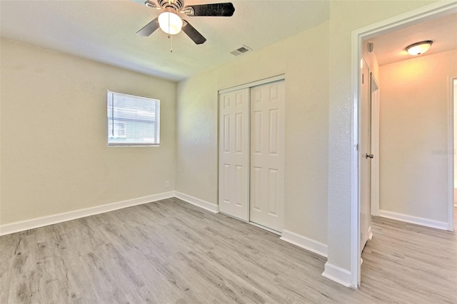 475 W Ethelene St, Bartow, FL 33830 - unfurnished bedroom with wood finished floors, a closet, and a ceiling fan