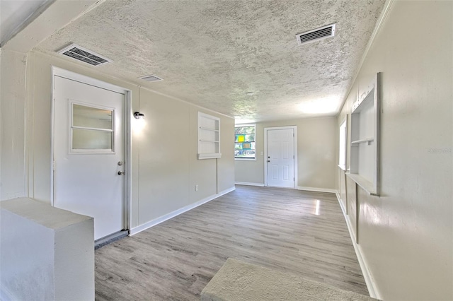 475 W Ethelene St, Bartow, FL 33830 - foyer featuring wood finished floors and a textured ceiling