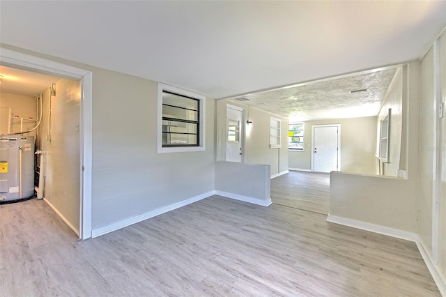 475 W Ethelene St, Bartow, FL 33830 - empty room with water heater and wood finished floors