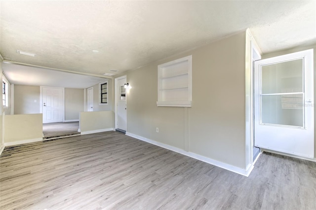475 W Ethelene St, Bartow, FL 33830 - unfurnished room featuring wood finished floors and a textured ceiling