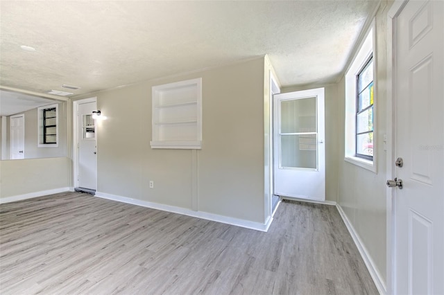 475 W Ethelene St, Bartow, FL 33830 - empty room featuring wood finished floors and a textured ceiling