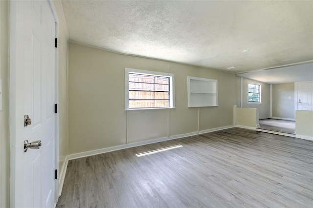 475 W Ethelene St, Bartow, FL 33830 - spare room featuring wood finished floors and a textured ceiling