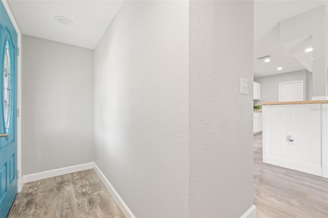 6012 Flora Ter, Apollo Beach, FL 33572 - hall with light wood finished floors and recessed lighting