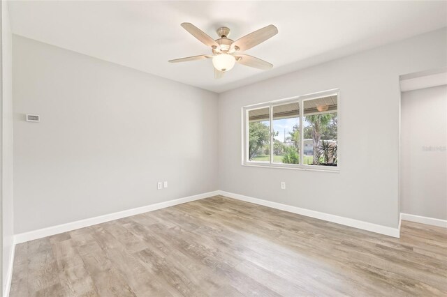 6012 Flora Ter, Apollo Beach, FL 33572 - spare room with a ceiling fan and light wood finished floors