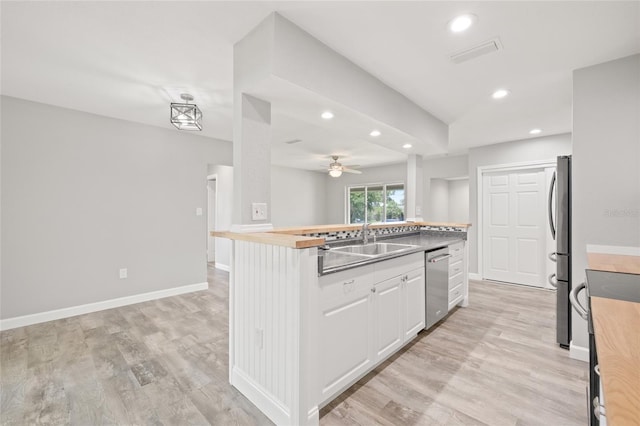 6012 Flora Ter, Apollo Beach, FL 33572 - kitchen featuring appliances with stainless steel finishes, recessed lighting, white cabinets, light wood-type flooring, and a ceiling fan