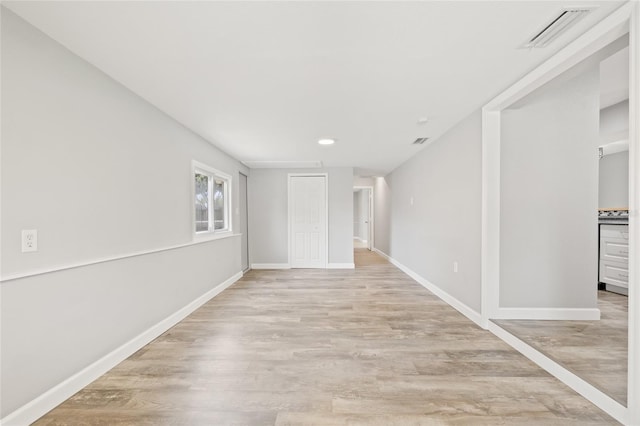 6012 Flora Ter, Apollo Beach, FL 33572 - empty room with light wood-type flooring and recessed lighting