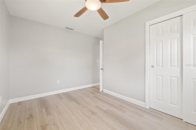 6012 Flora Ter, Apollo Beach, FL 33572 - unfurnished bedroom featuring light wood finished floors and a ceiling fan