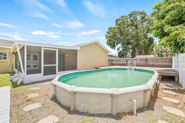 6012 Flora Ter, Apollo Beach, FL 33572 - view of pool featuring a sunroom and a fenced backyard