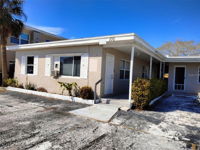 100 144th Ave, Madeira Beach, FL 33708 - property entrance featuring stucco siding