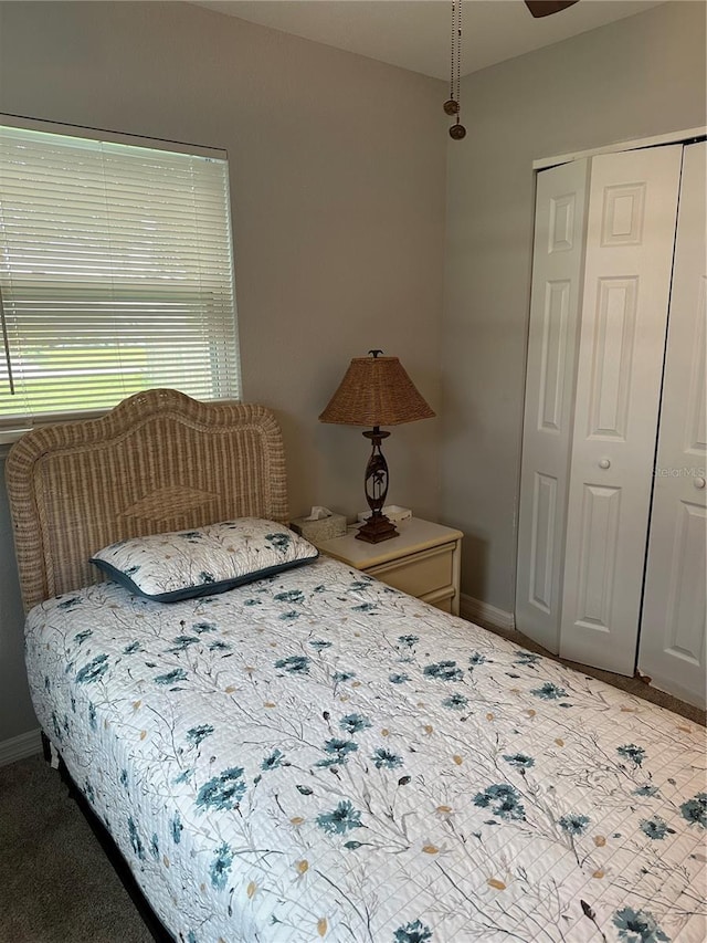 7651 46th Way N, Pinellas Park, FL 33781 - carpeted bedroom featuring a closet and baseboards
