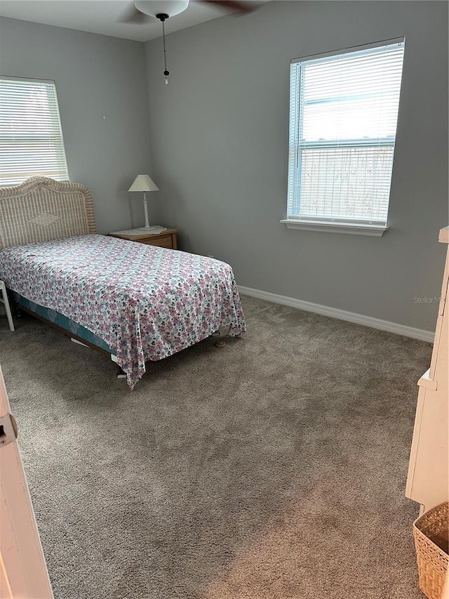 7651 46th Way N, Pinellas Park, FL 33781 - carpeted bedroom featuring baseboards