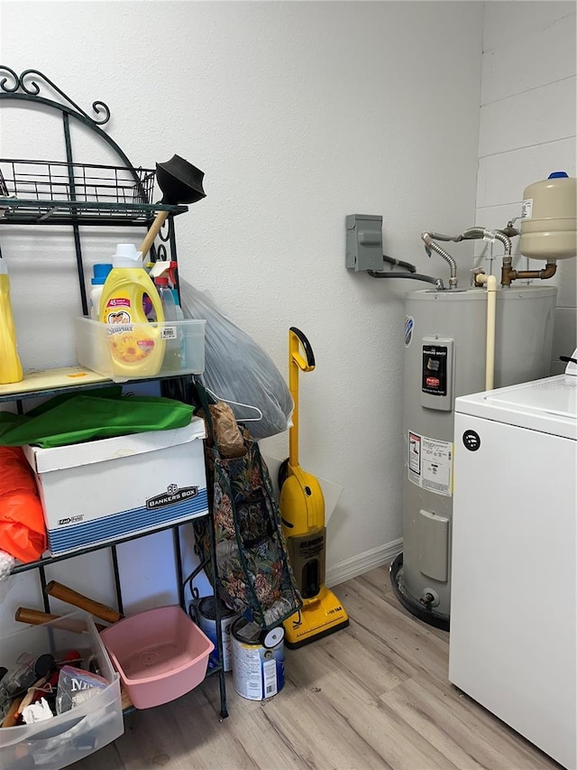 7651 46th Way N, Pinellas Park, FL 33781 - laundry room with washer / clothes dryer, wood finished floors, and water heater