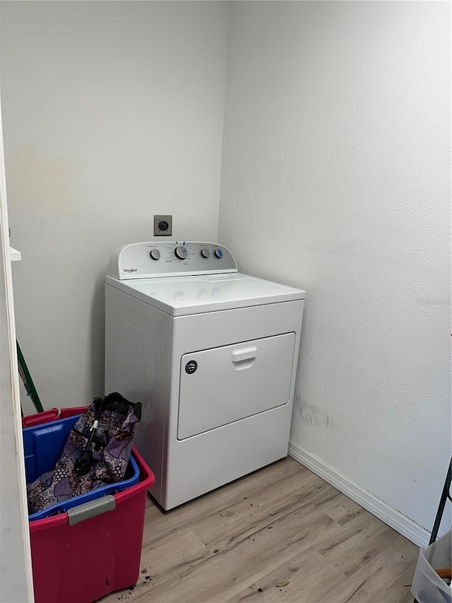 7651 46th Way N, Pinellas Park, FL 33781 - laundry area featuring washer / dryer and light wood-style flooring