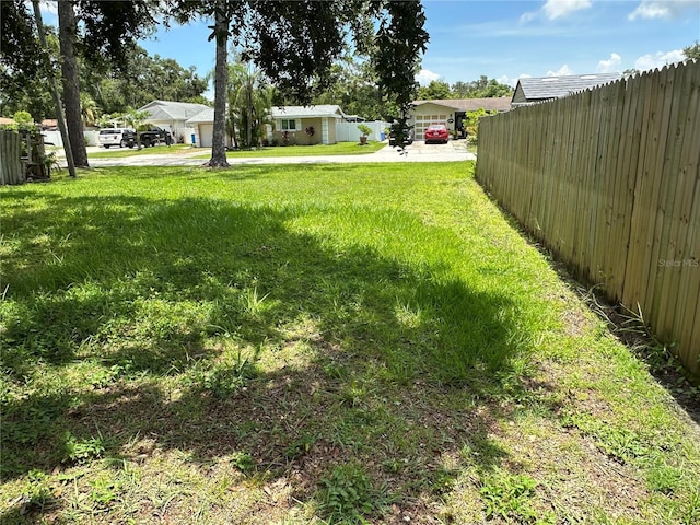 7651 46th Way N, Pinellas Park, FL 33781 - view of yard featuring driveway and a detached carport