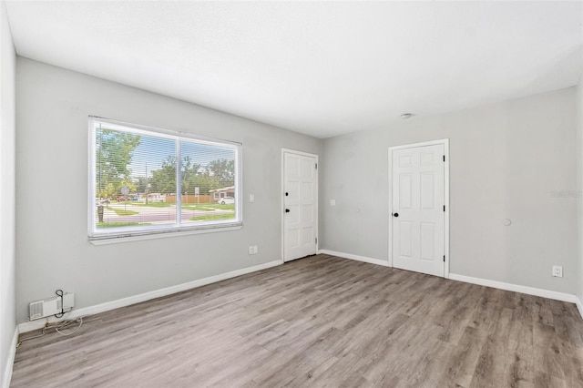 7891 67th St N, Pinellas Park, FL 33781 - unfurnished room featuring wood finished floors and baseboards