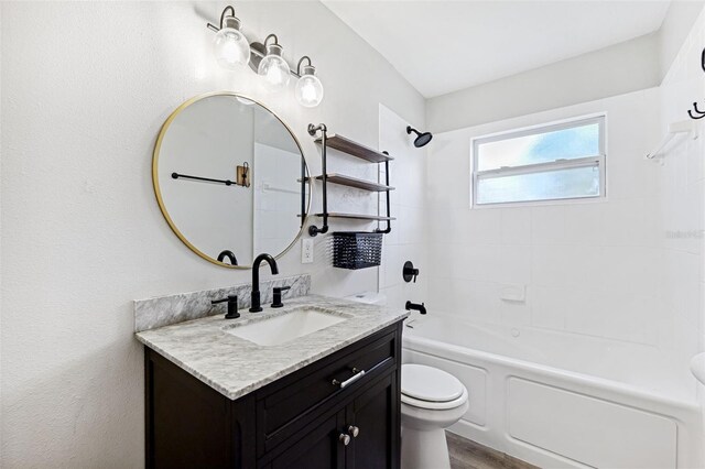 7891 67th St N, Pinellas Park, FL 33781 - bathroom with vanity, tub / shower combination, and wood finished floors