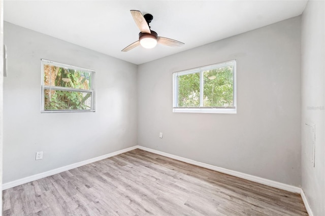 7891 67th St N, Pinellas Park, FL 33781 - unfurnished room featuring healthy amount of natural light, wood finished floors, and ceiling fan