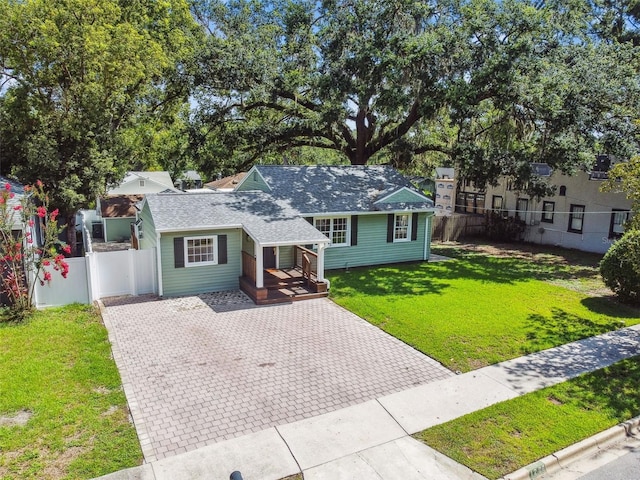 1208 E Crenshaw St, Tampa, FL 33604 - view of front of home featuring decorative driveway and a shingled roof