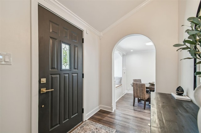 1208 E Crenshaw St, Tampa, FL 33604 - foyer entrance featuring arched walkways, dark wood-type flooring, and ornamental molding
