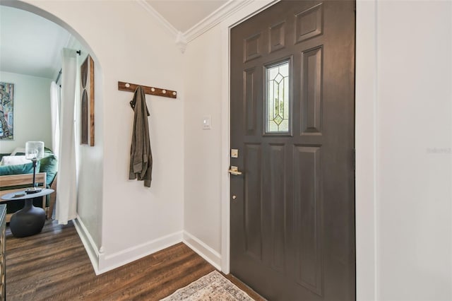 1208 E Crenshaw St, Tampa, FL 33604 - foyer with arched walkways, dark wood-style floors, and ornamental molding