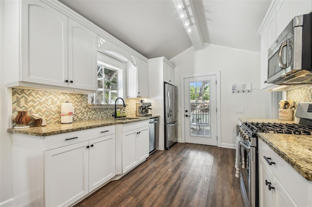 1208 E Crenshaw St, Tampa, FL 33604 - kitchen with appliances with stainless steel finishes, dark wood-style floors, decorative backsplash, light stone counters, and white cabinetry