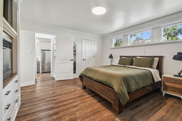 1208 E Crenshaw St, Tampa, FL 33604 - bedroom featuring built in fridge, dark wood-style floors, and crown molding