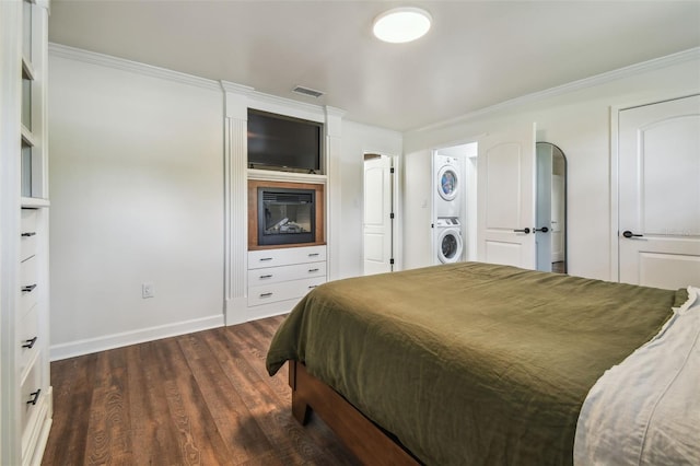 1208 E Crenshaw St, Tampa, FL 33604 - bedroom featuring stacked washer / drying machine, dark wood-type flooring, and ornamental molding
