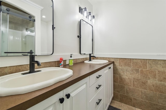 1208 E Crenshaw St, Tampa, FL 33604 - full bath with double vanity, a stall shower, recessed lighting, a wainscoted wall, and tile walls