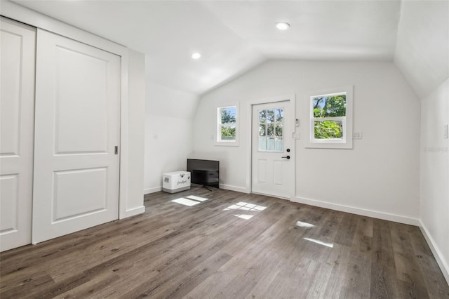 1208 E Crenshaw St, Tampa, FL 33604 - bonus room featuring lofted ceiling, wood finished floors, and recessed lighting