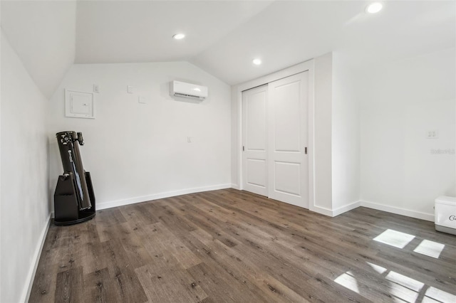 1208 E Crenshaw St, Tampa, FL 33604 - additional living space with a wall mounted AC, wood finished floors, lofted ceiling, and recessed lighting