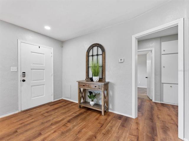5514 7th Ave N, Saint Petersburg, FL 33710 - foyer featuring wood finished floors, a textured wall, and recessed lighting