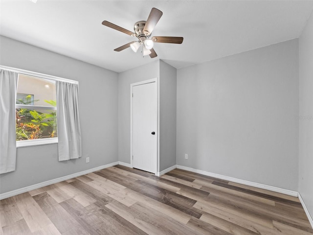 5514 7th Ave N, Saint Petersburg, FL 33710 - empty room featuring a ceiling fan and wood finished floors