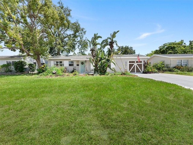 5514 7th Ave N, Saint Petersburg, FL 33710 - view of green lawn with concrete driveway