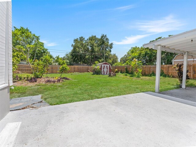 5514 7th Ave N, Saint Petersburg, FL 33710 - fenced backyard featuring a storage shed and a patio area