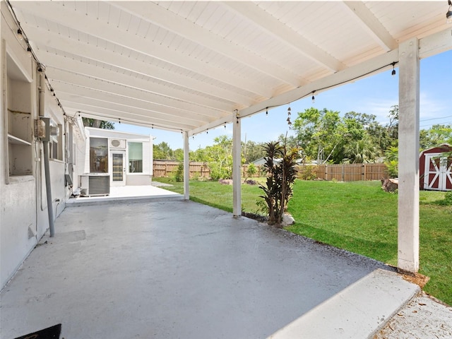 5514 7th Ave N, Saint Petersburg, FL 33710 - fenced backyard featuring a patio area and a shed