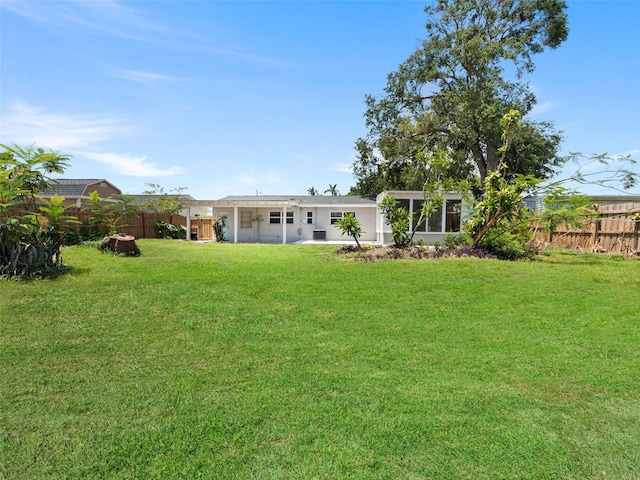 5514 7th Ave N, Saint Petersburg, FL 33710 - back of house with a fenced backyard