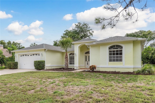 1156 Ridgegrove Dr W, Palm Harbor, FL 34683 - single story home featuring a garage, concrete driveway, stucco siding, and a front lawn
