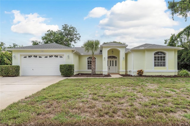 1156 Ridgegrove Dr W, Palm Harbor, FL 34683 - ranch-style house featuring an attached garage, driveway, stucco siding, and a front yard