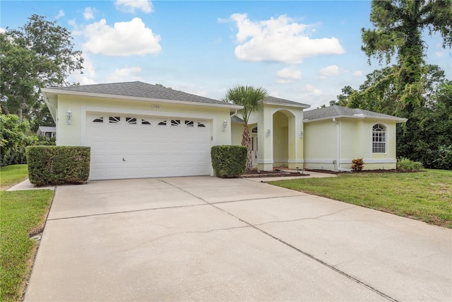 1156 Ridgegrove Dr W, Palm Harbor, FL 34683 - single story home with concrete driveway, a front yard, an attached garage, and stucco siding