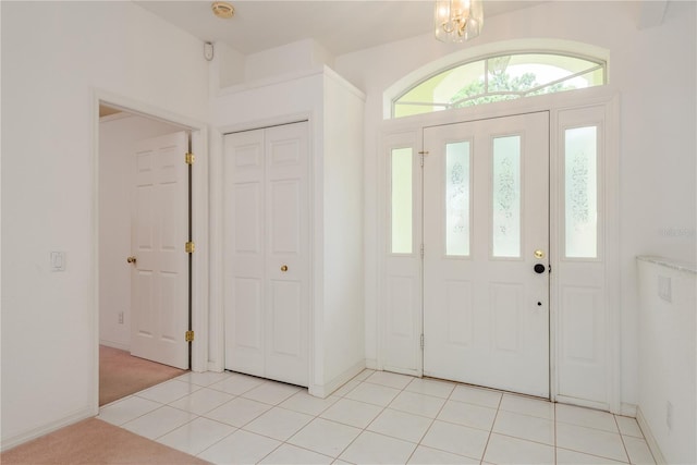 1156 Ridgegrove Dr W, Palm Harbor, FL 34683 - foyer entrance featuring a chandelier and light tile patterned flooring
