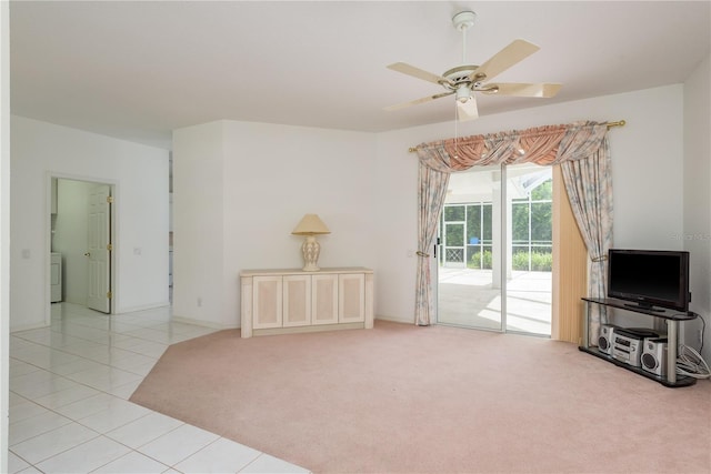 1156 Ridgegrove Dr W, Palm Harbor, FL 34683 - unfurnished living room featuring a ceiling fan, tile patterned flooring, carpet, and washer / clothes dryer