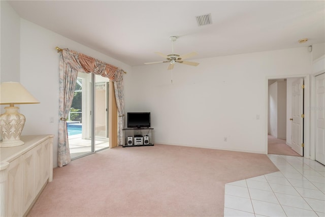 1156 Ridgegrove Dr W, Palm Harbor, FL 34683 - unfurnished living room with light carpet, a ceiling fan, and light tile patterned flooring